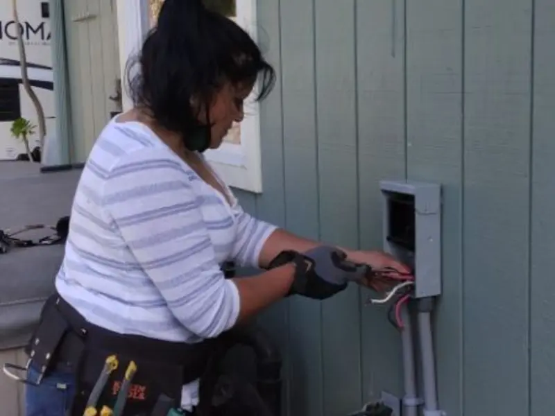 Licensed electrician wiring an exterior subpanel in Santa Fe